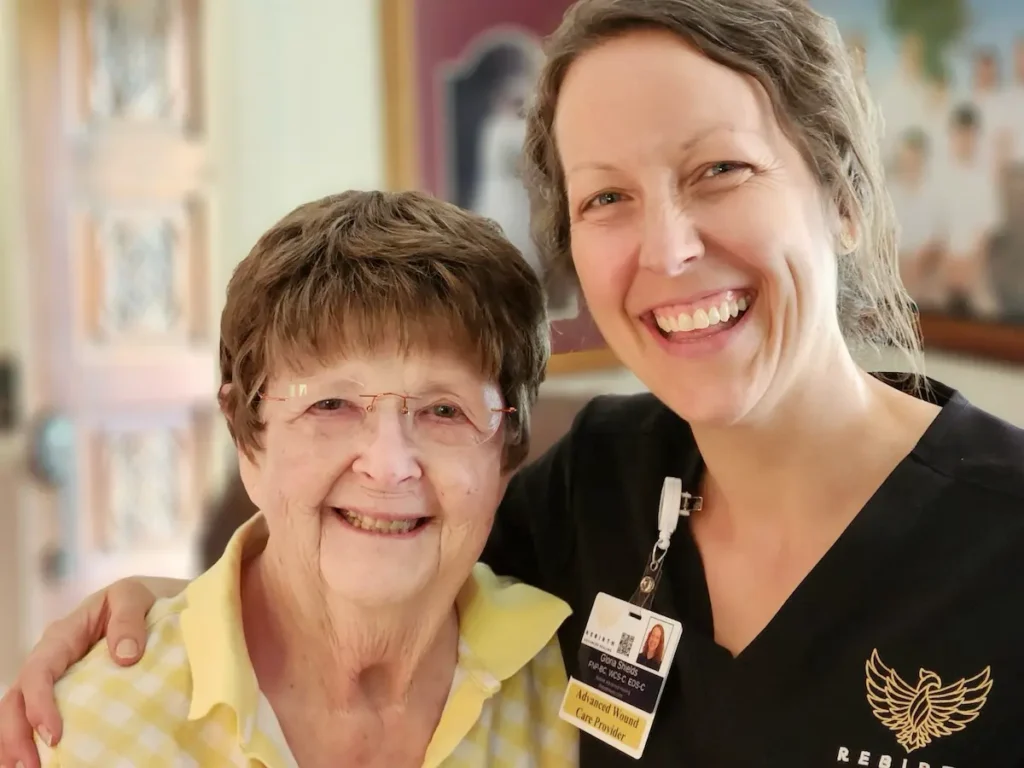 A clinician from Rebirth Advanced Healing and a wound care patient.