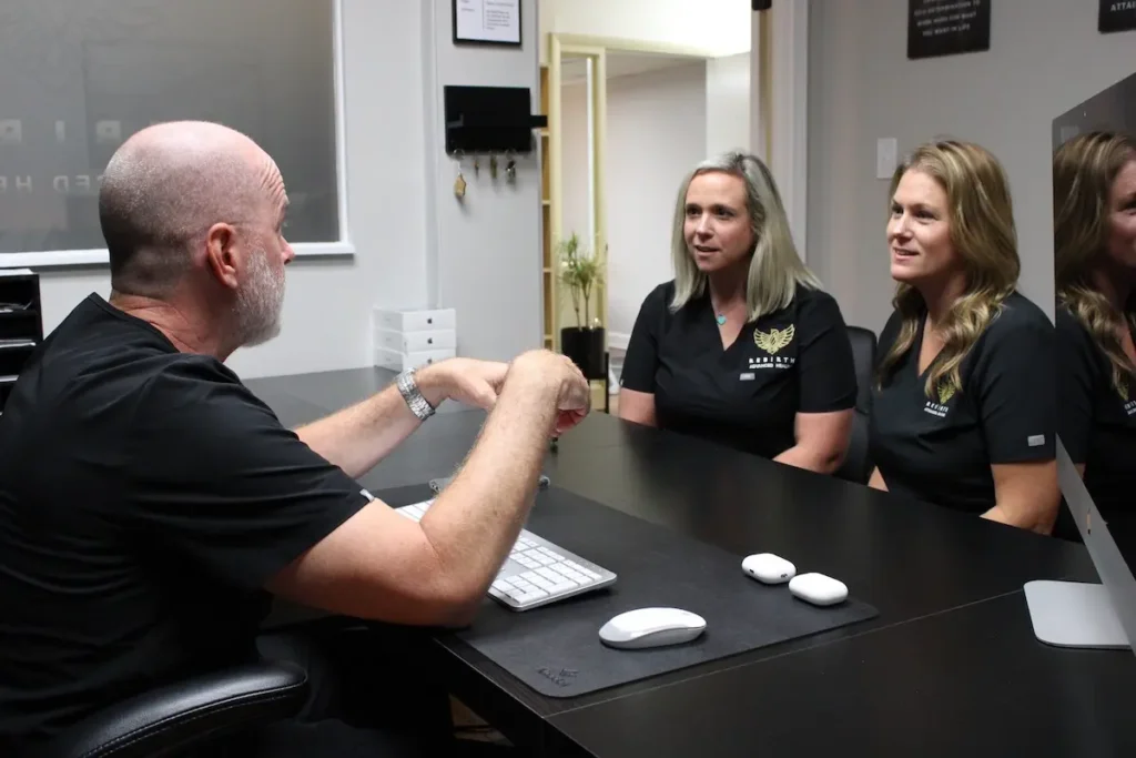 Dr. Chris Mason meets with Rebirth Advanced Healing team members.