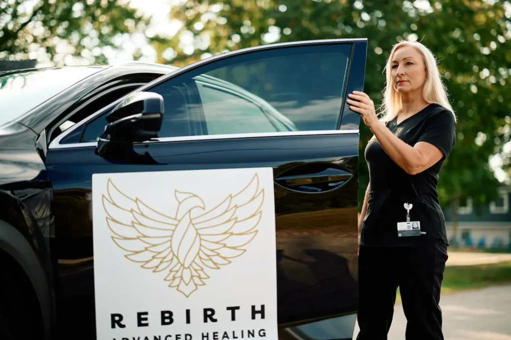 A Rebirth Advanced Healing clinician exits her vehicle to offer advanced mobile wound care to a patient in their home.