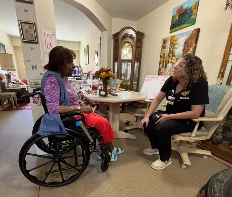 Rebirth Nurse Practitioner Holly Maddox meets with a chronic wound patient