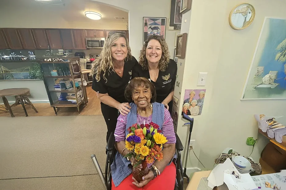 Winifred Washington poses with her Rebirth care team after her chronic wound healed